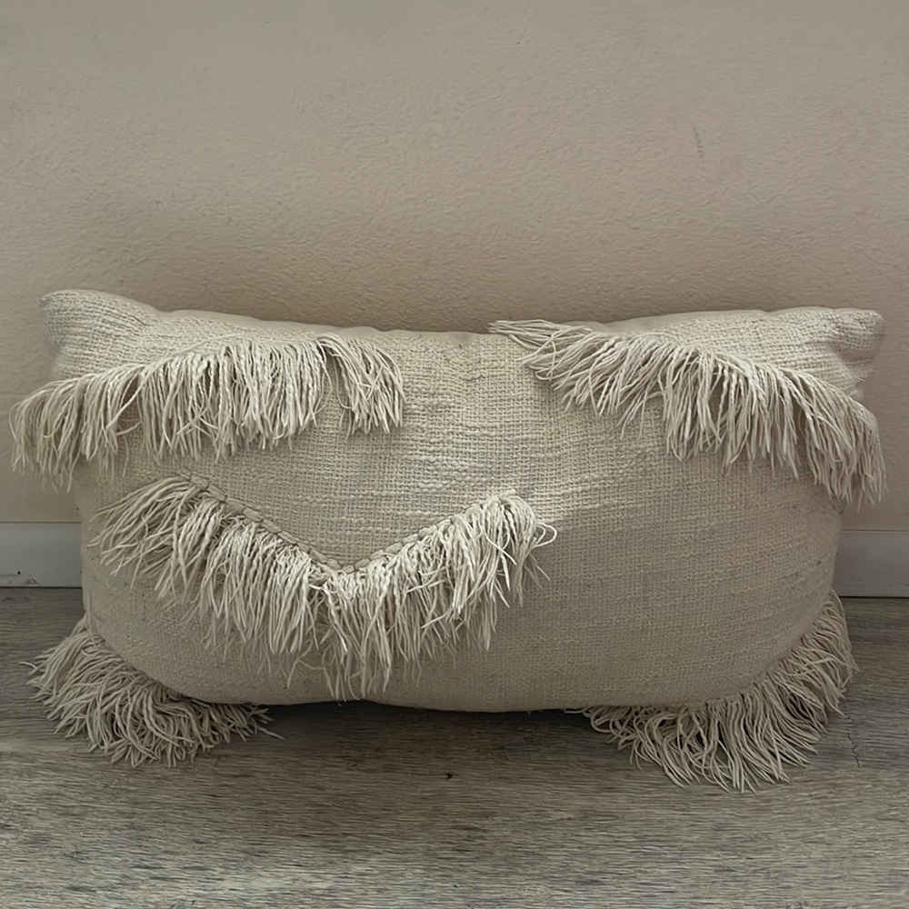 Cream throw pillow